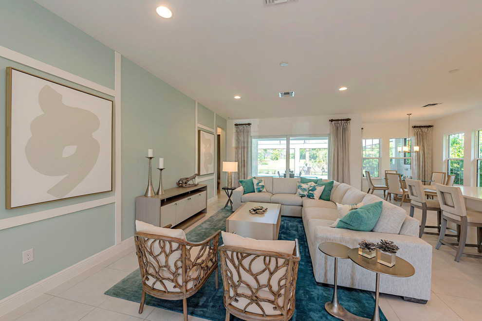 Foto di un soggiorno contemporaneo di medie dimensioni e aperto con pareti blu, pavimento con piastrelle in ceramica e pavimento bianco