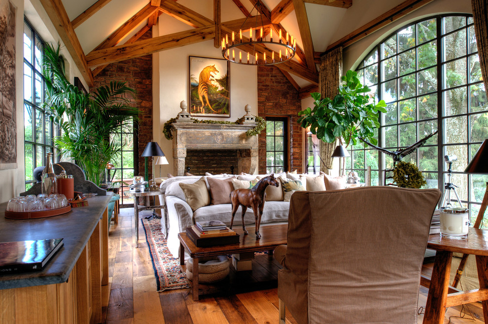 Expansive country living room in Other with a standard fireplace.