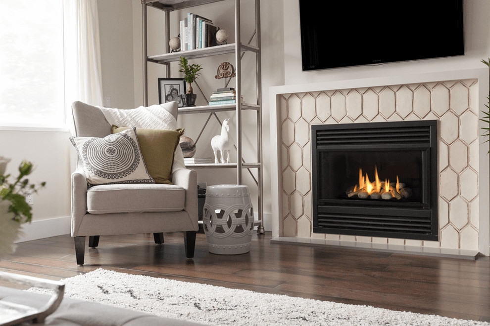 Photo of a medium sized contemporary open plan living room in Boston with white walls, dark hardwood flooring, a standard fireplace, a tiled fireplace surround, a wall mounted tv and brown floors.