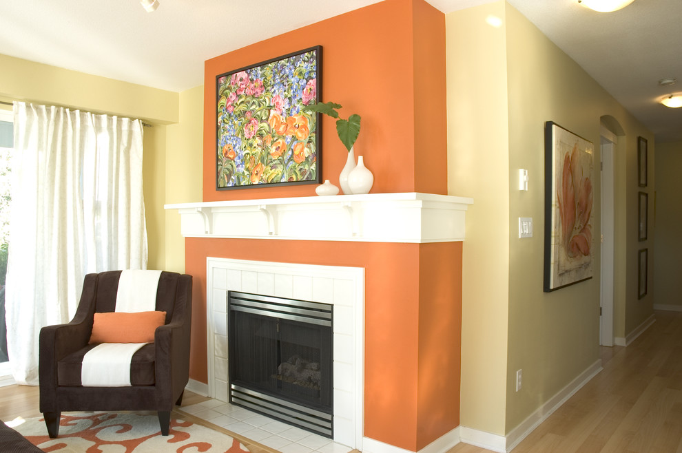 Living room - contemporary living room idea in Vancouver with a tile fireplace