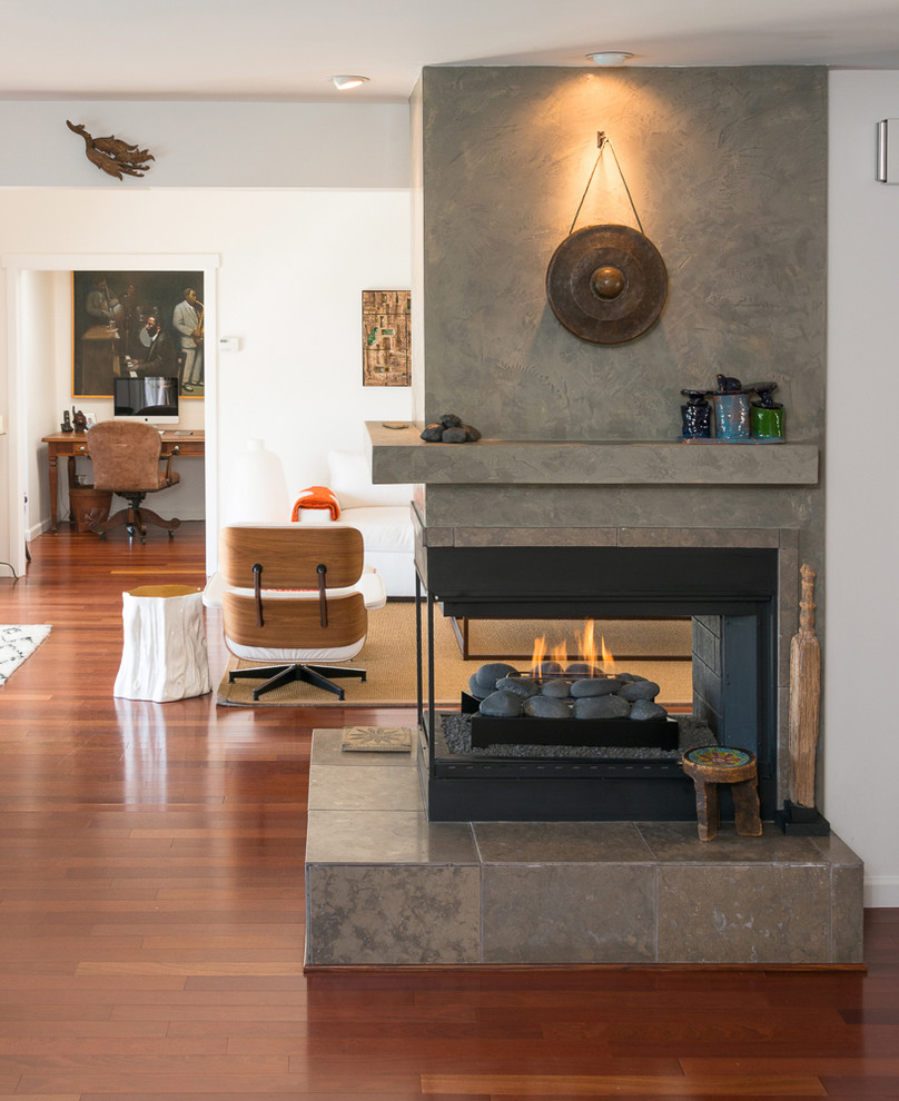 Inspiration for a contemporary living room in Los Angeles with a two-sided fireplace.