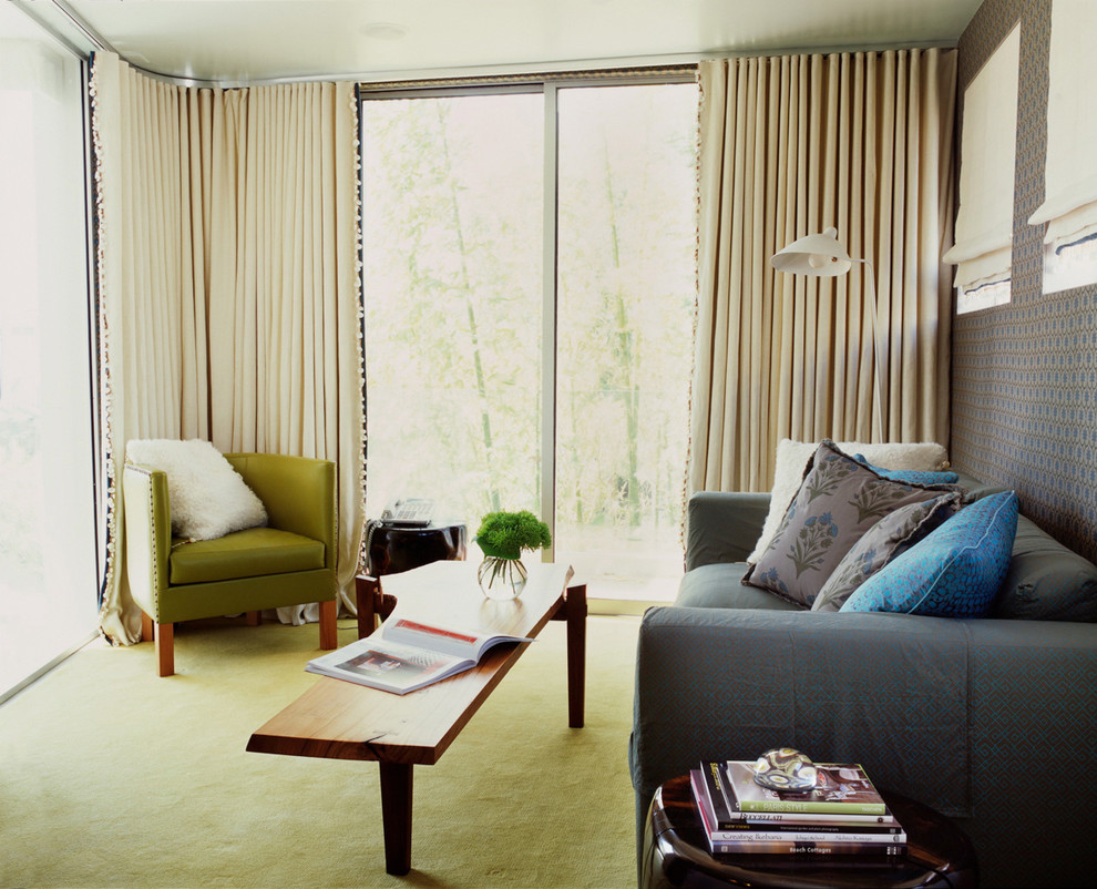 Small trendy enclosed carpeted and green floor living room photo in Los Angeles with blue walls, no fireplace and no tv