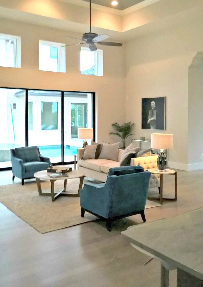 Expansive contemporary living room in Austin with white walls and medium hardwood flooring.