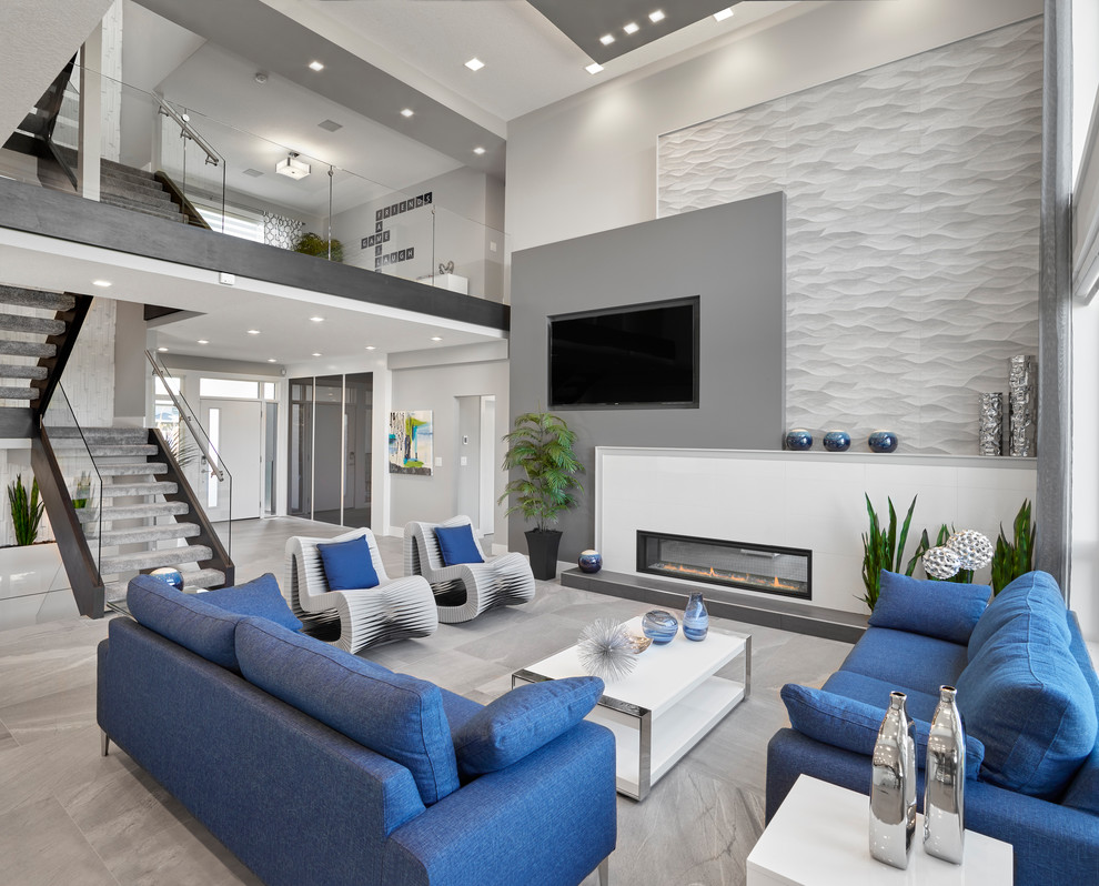 Large contemporary mezzanine living room in Edmonton with grey walls, ceramic flooring, a standard fireplace, a tiled fireplace surround, a built-in media unit and grey floors.