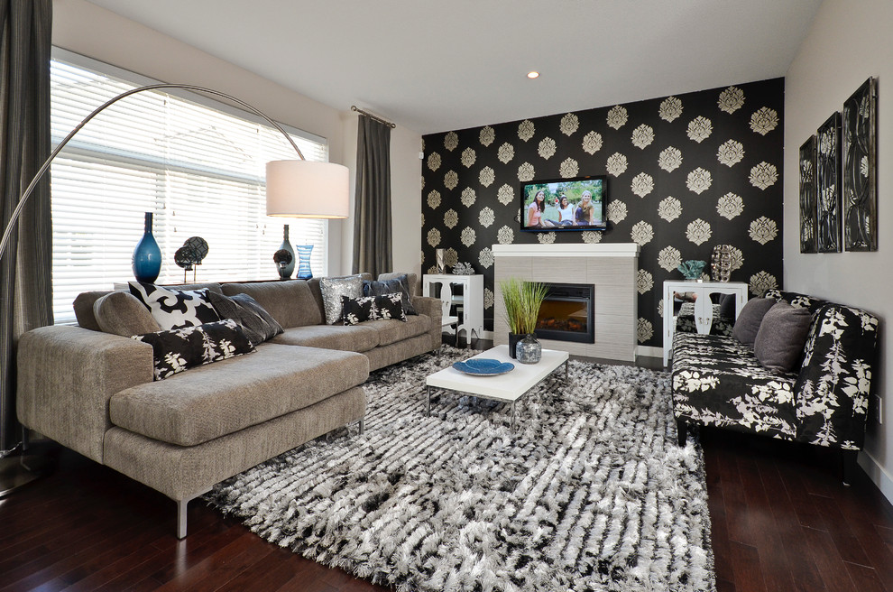Example of a trendy enclosed living room design in Vancouver with a standard fireplace and a wall-mounted tv