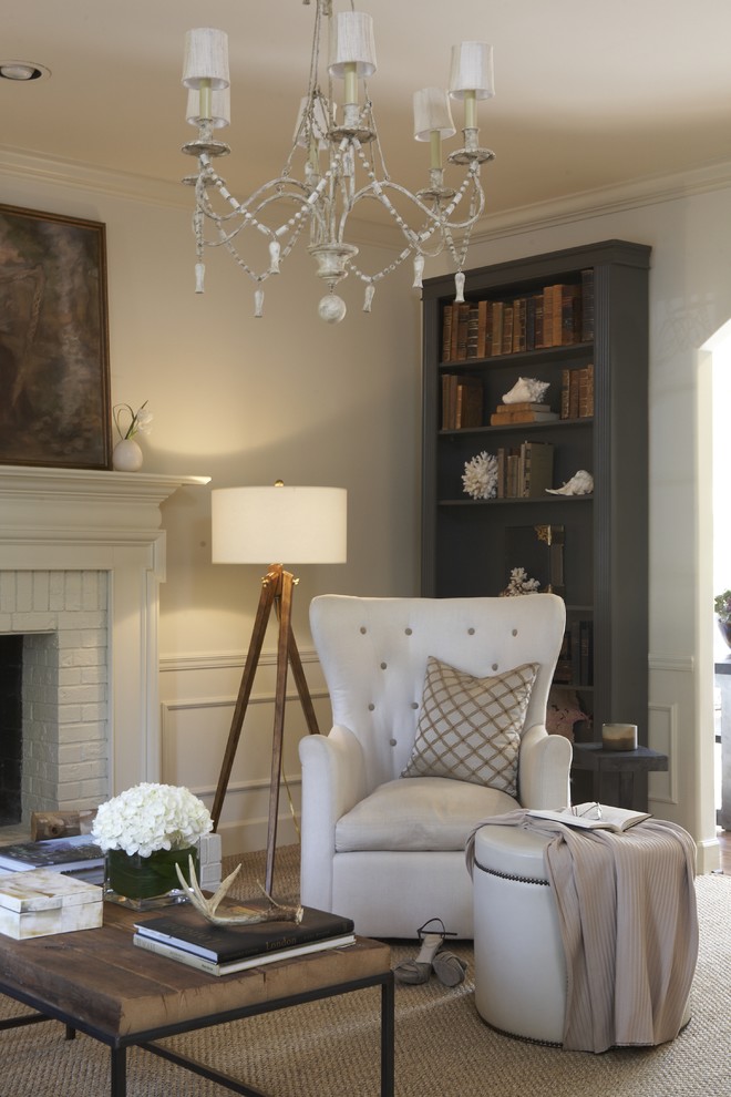 Example of a classic living room design in Birmingham with a standard fireplace and a brick fireplace