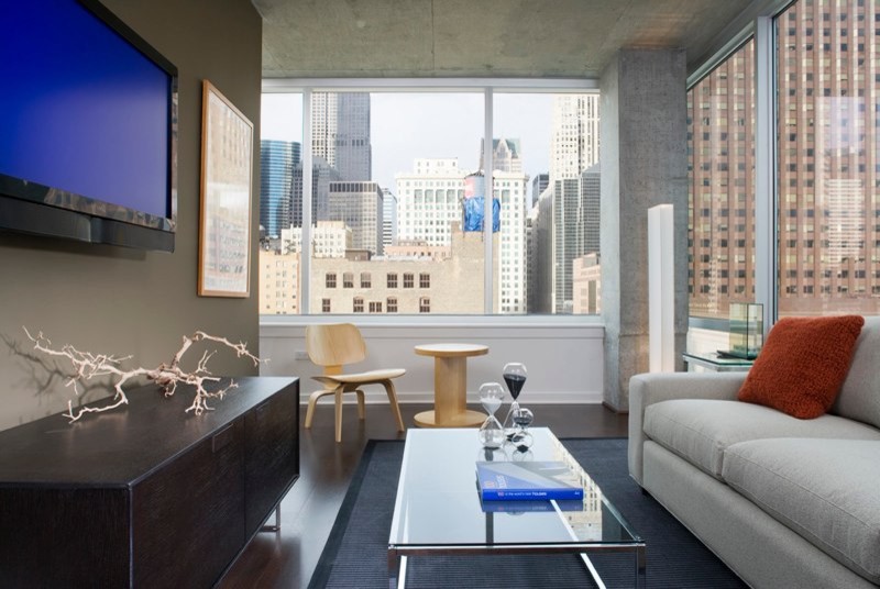 Living room - modern dark wood floor living room idea in Chicago with gray walls