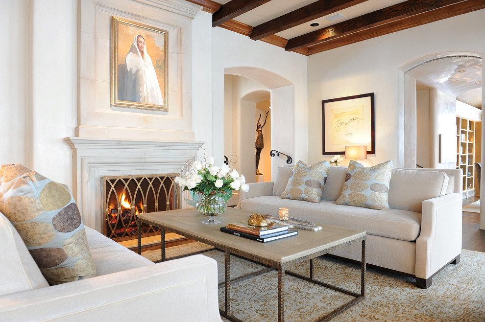 Photo of a mediterranean formal enclosed living room in Other with beige walls and a standard fireplace.