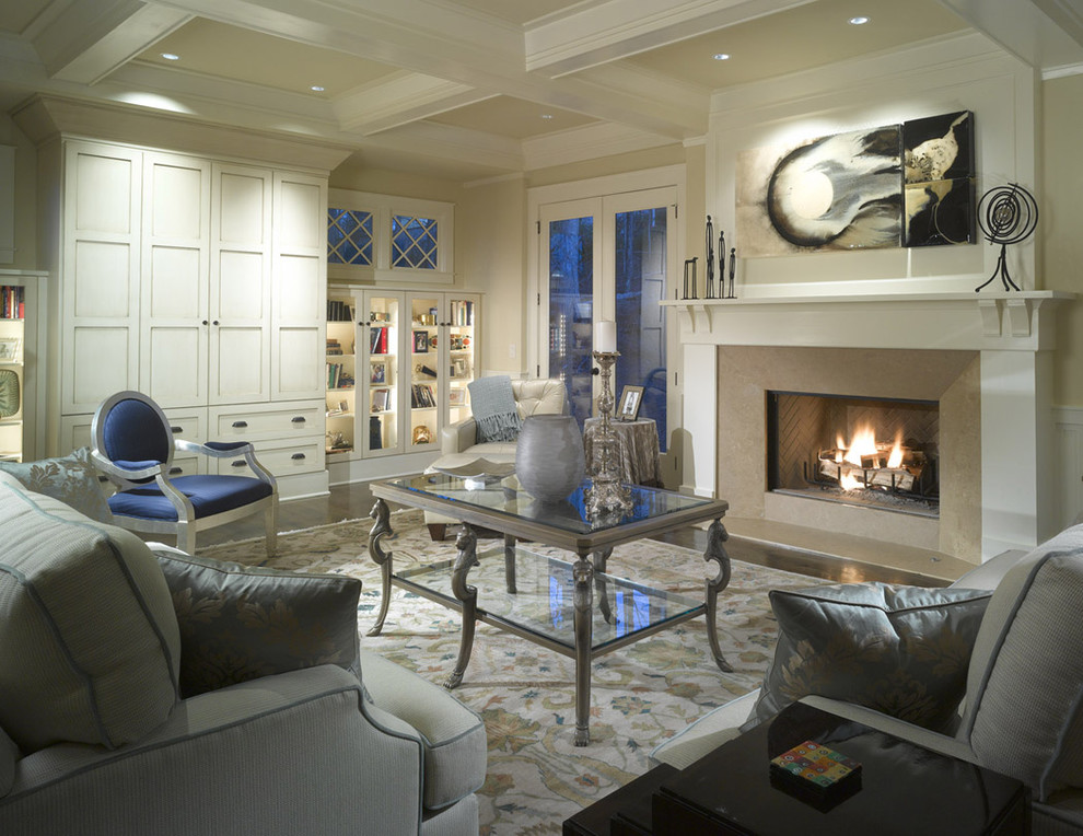 Example of a large classic enclosed living room design in Atlanta with beige walls, a standard fireplace and no tv