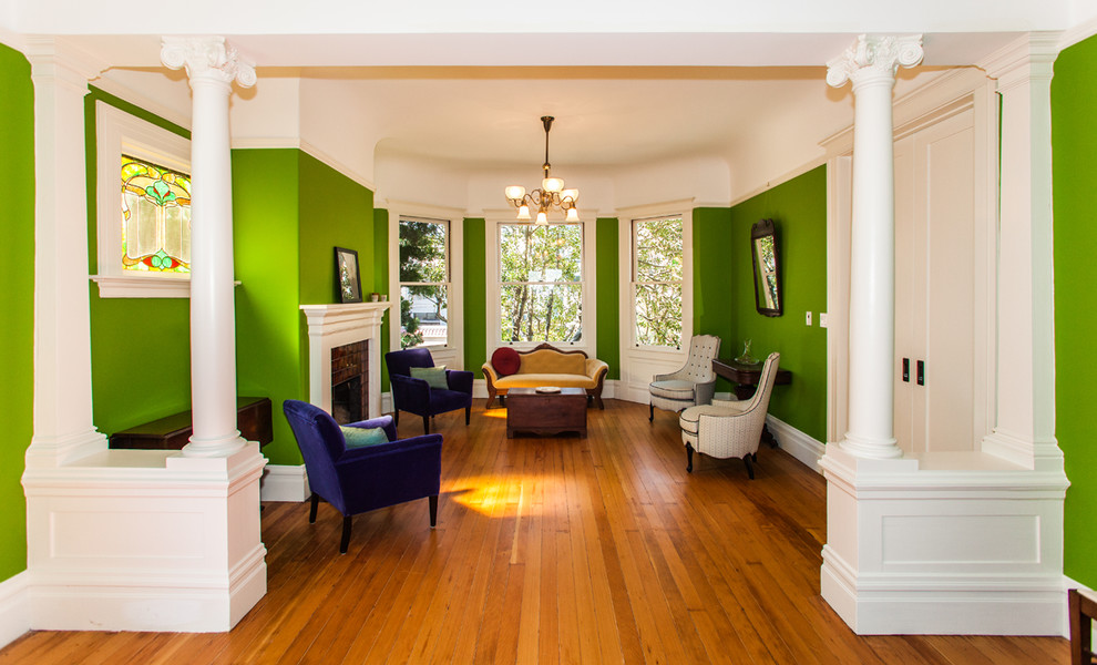 Living room - victorian living room idea in San Francisco with green walls