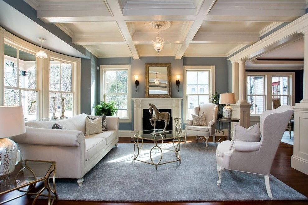 This is an example of a large victorian formal open plan living room in Boston with blue walls, medium hardwood flooring, no fireplace, no tv, brown floors and feature lighting.