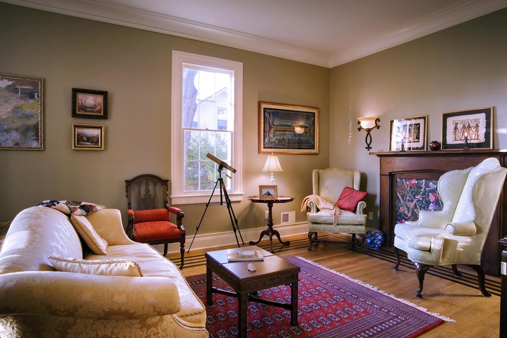 Inspiration for a medium sized victorian formal enclosed living room in Philadelphia with beige walls, light hardwood flooring, no fireplace, no tv and brown floors.