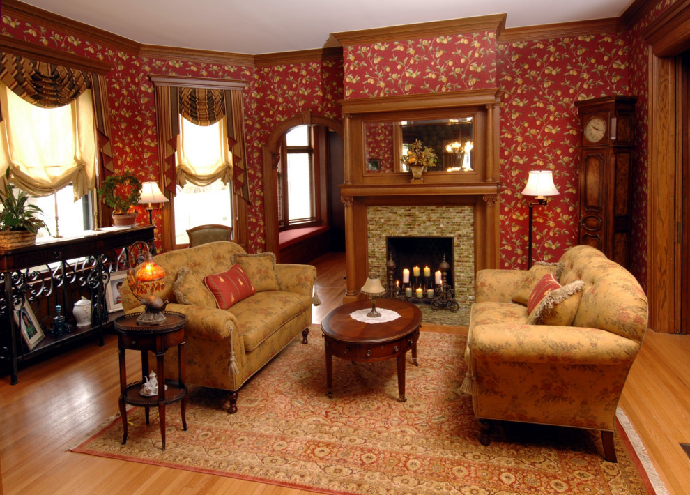 Inspiration for a medium sized victorian formal enclosed living room in New York with light hardwood flooring, a standard fireplace, a tiled fireplace surround and no tv.