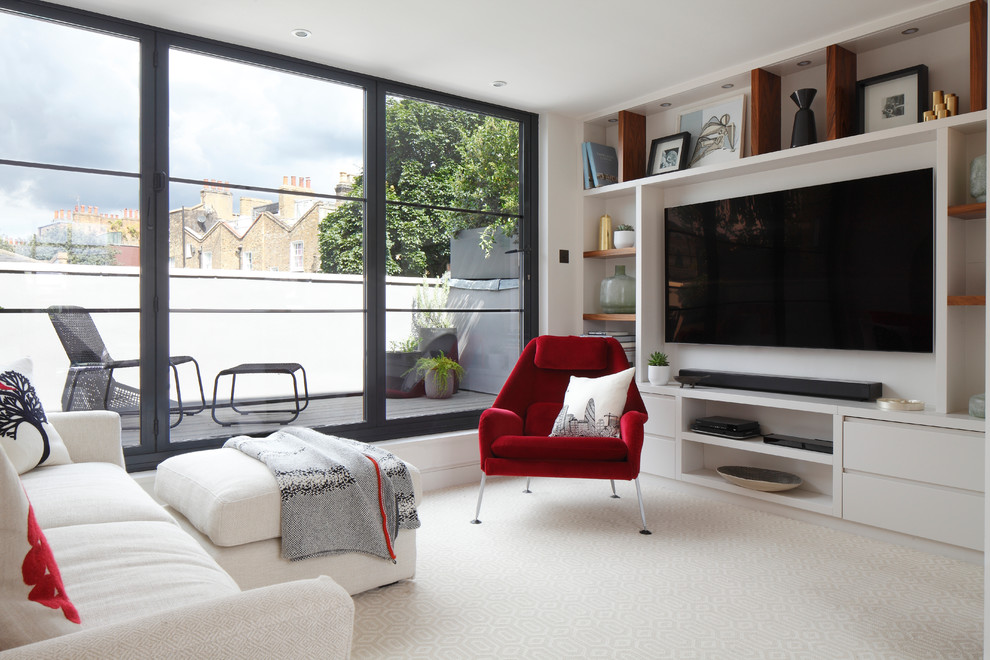 Trendy carpeted living room photo in London with white walls