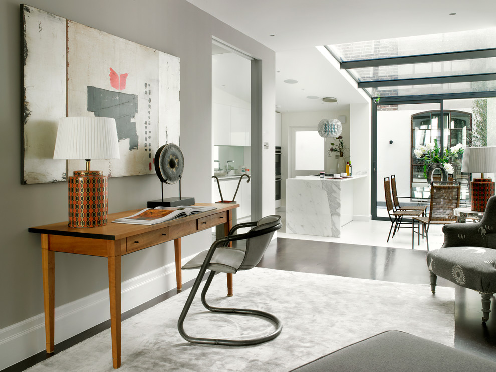 Medium sized contemporary open plan living room in London with grey walls, dark hardwood flooring and black floors.