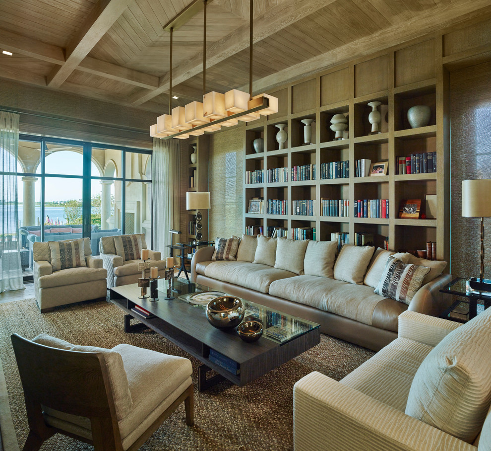 Inspiration for a mediterranean enclosed living room in Dallas with a reading nook, brown walls and brown floors.