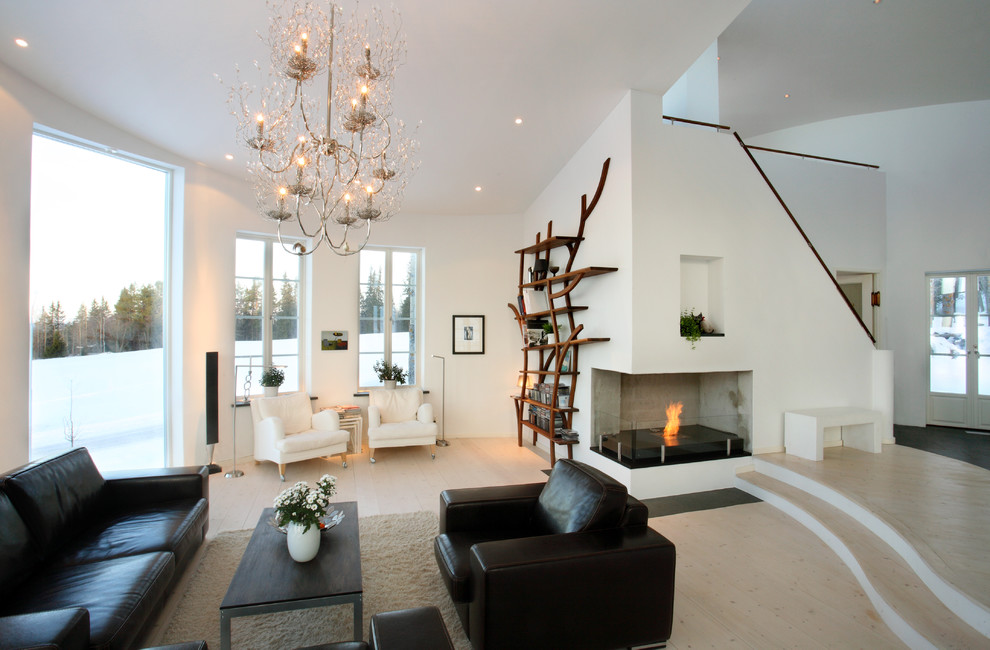Immagine di un grande soggiorno scandinavo aperto con sala formale, pareti bianche e parquet chiaro