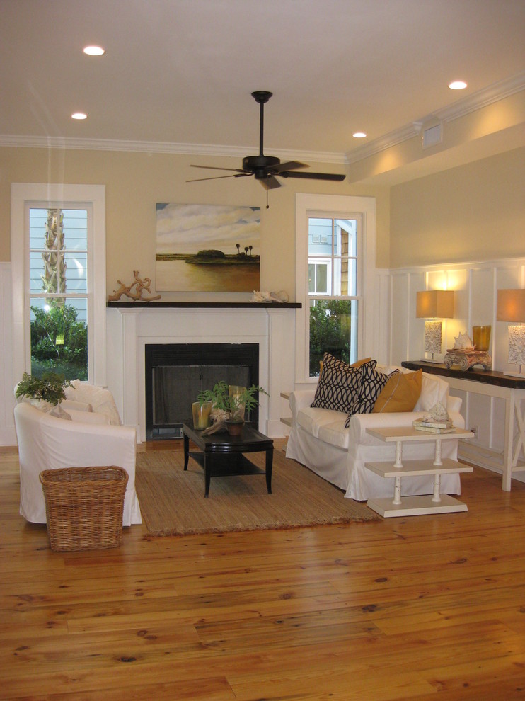 Пример оригинального дизайна: парадная гостиная комната среднего размера в морском стиле с бежевыми стенами, паркетным полом среднего тона, стандартным камином, фасадом камина из дерева и коричневым полом без телевизора