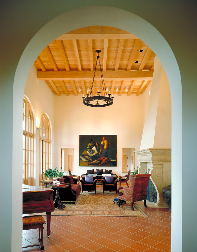 Example of a tuscan formal terra-cotta tile living room design in San Francisco with white walls