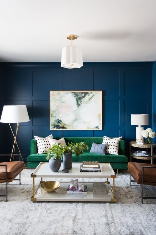 Mid-sized transitional medium tone wood floor living room photo in Salt Lake City with blue walls
