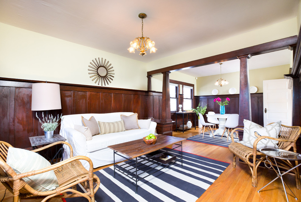 Living room - craftsman open concept medium tone wood floor living room idea in San Francisco with yellow walls