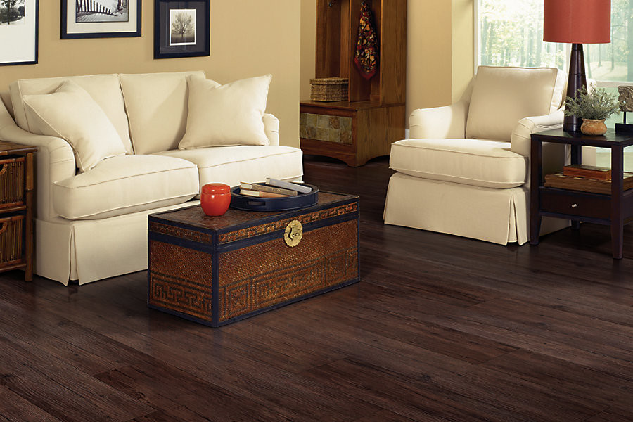 Example of a classic vinyl floor living room design in Indianapolis with beige walls