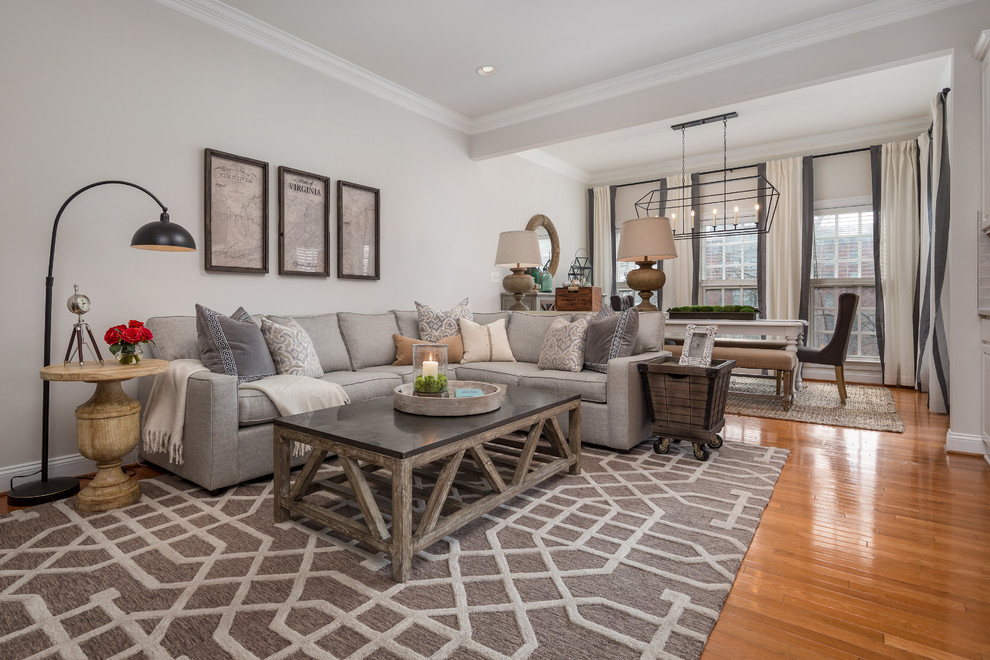 Cottage medium tone wood floor and brown floor living room photo in DC Metro with gray walls