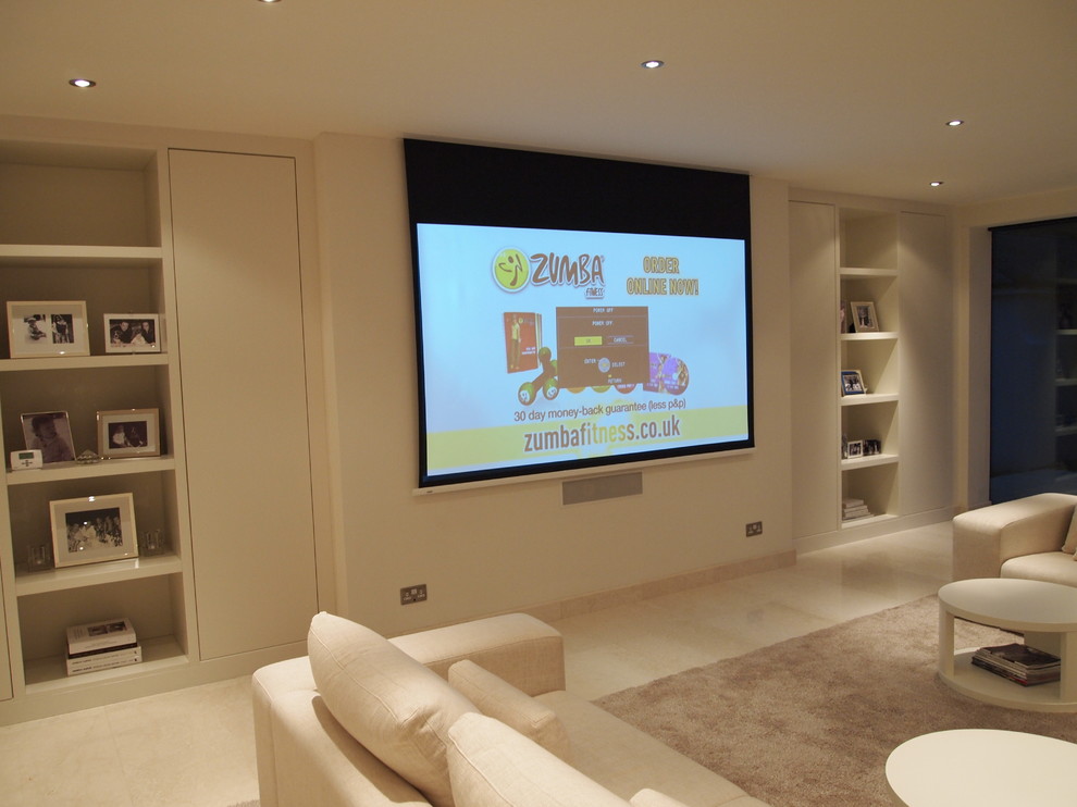 This is an example of a large contemporary formal open plan living room in Surrey with white walls and a built-in media unit.