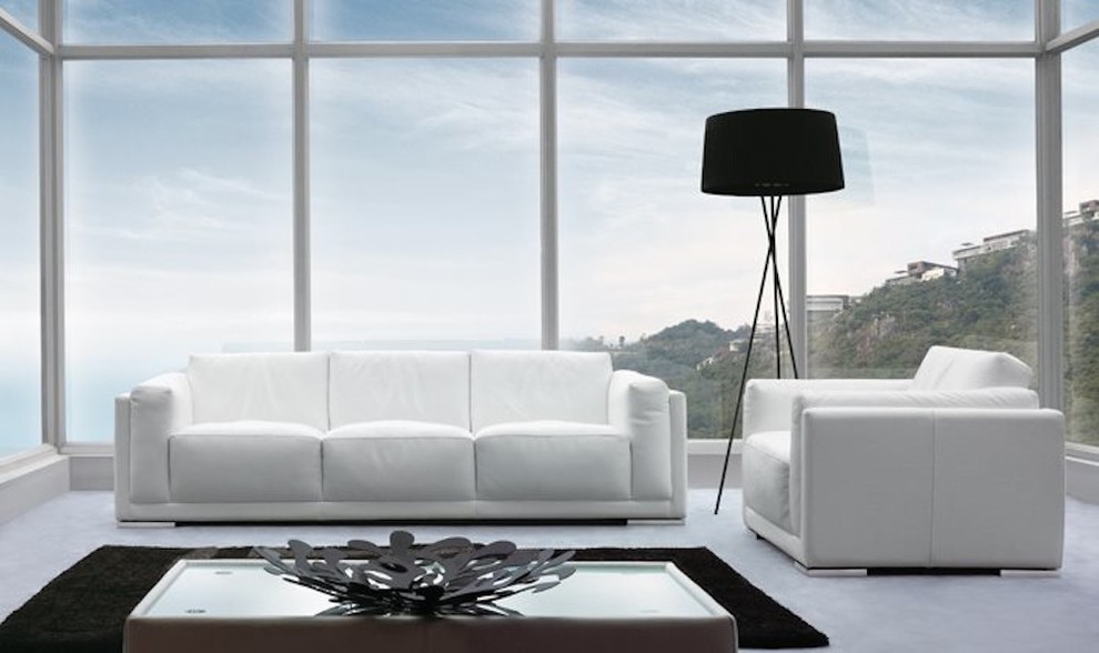 Esempio di un grande soggiorno design con pareti bianche, pavimento in marmo e nessun camino