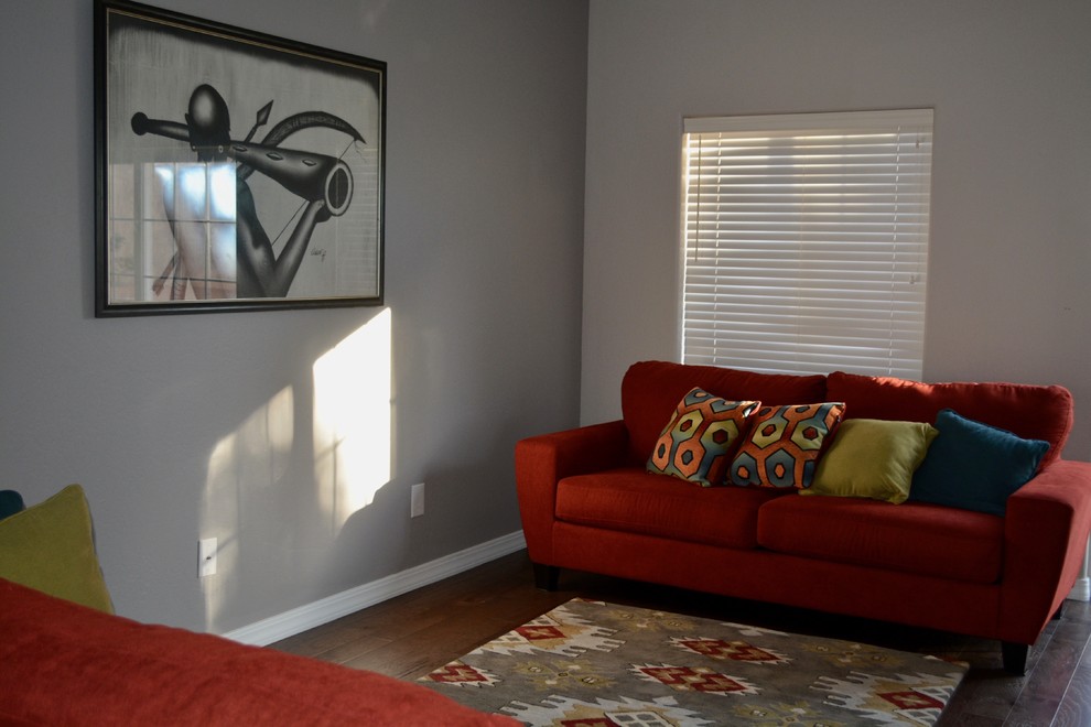 This is an example of a small contemporary enclosed living room in Albuquerque with grey walls, dark hardwood flooring, no fireplace and brown floors.