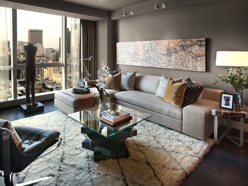 Contemporary living room in Boston with grey walls and feature lighting.