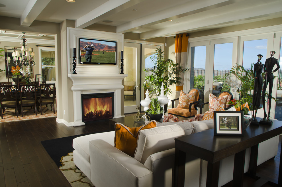 Design ideas for a large contemporary living room in Denver with beige walls and a standard fireplace.