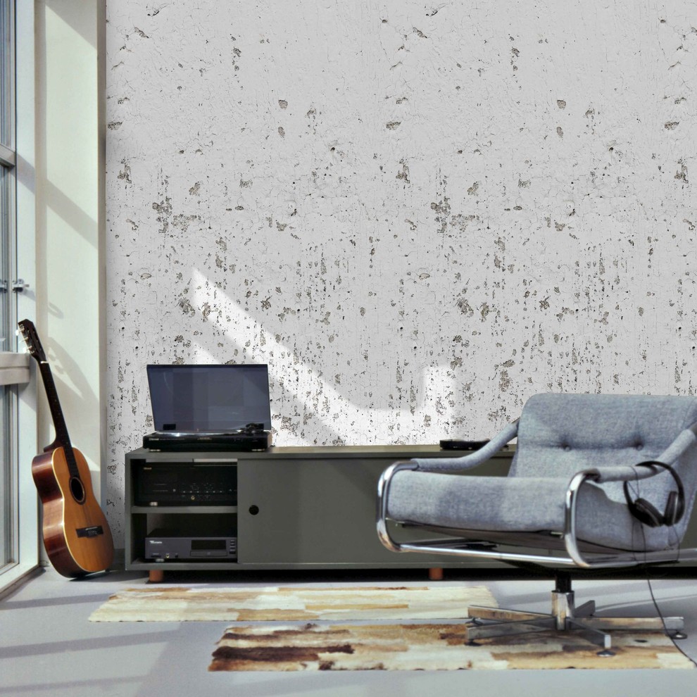 Modelo de salón abierto urbano grande sin televisor con paredes beige, suelo laminado y suelo azul