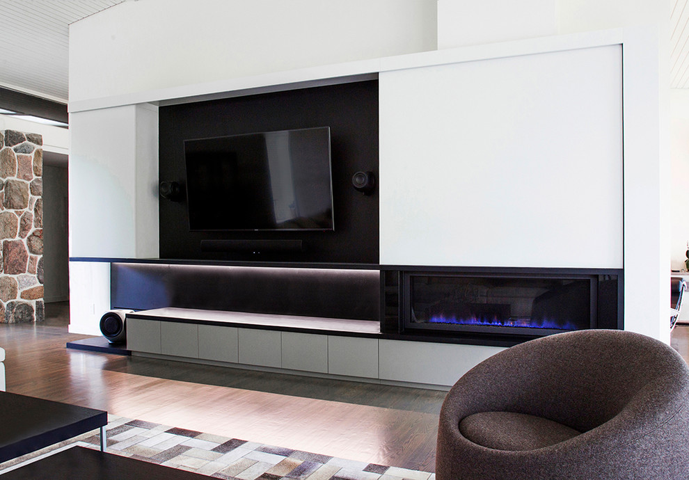 Inspiration for a large contemporary open plan living room in Toronto with white walls, a built-in media unit, a home bar, a standard fireplace and a wooden fireplace surround.