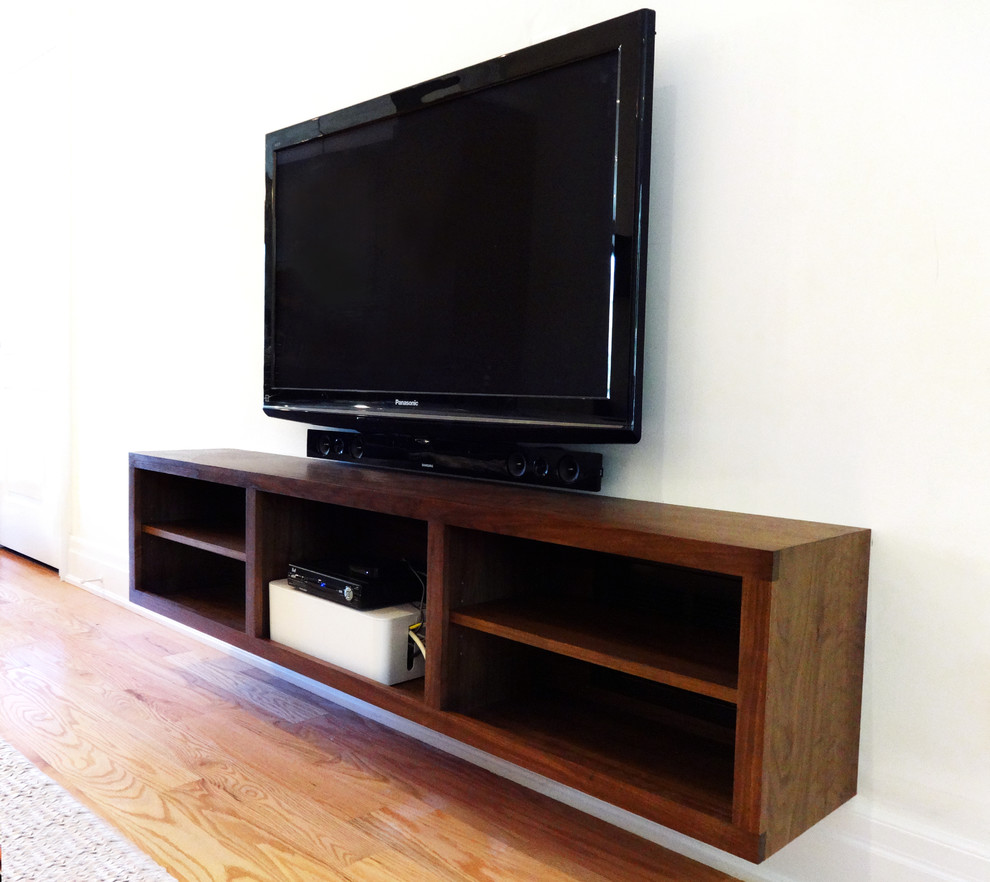Example of a minimalist living room design in Toronto with a wall-mounted tv