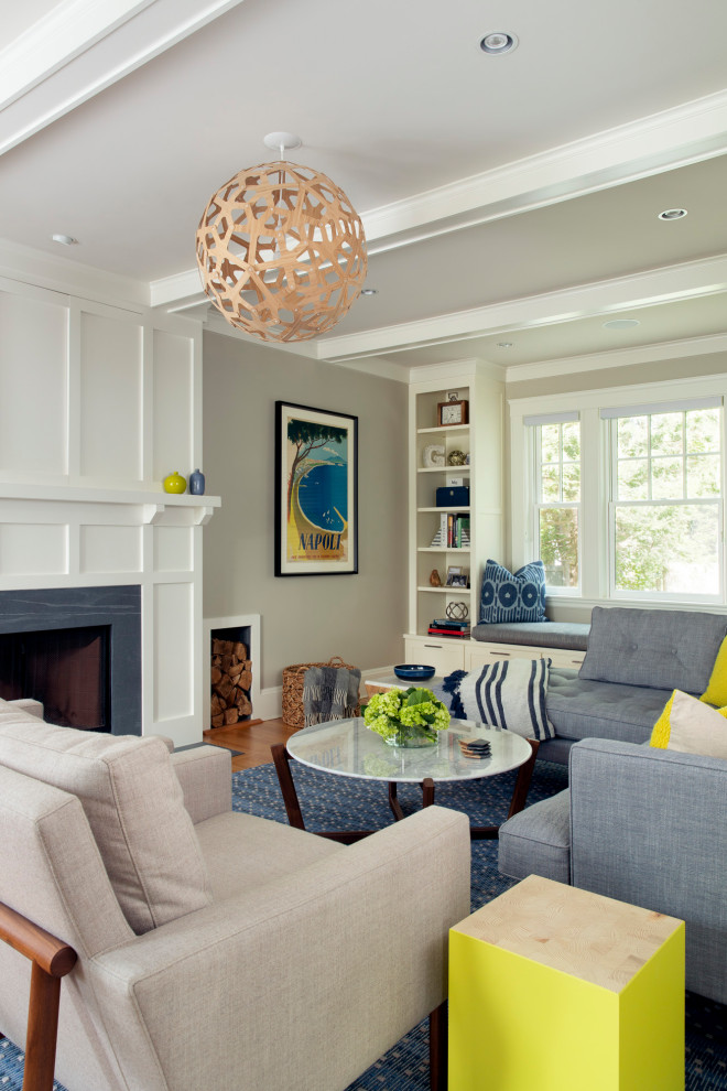 Inspiration for a medium sized classic formal open plan living room in Boston with beige walls, light hardwood flooring, a standard fireplace, a stone fireplace surround and a concealed tv.