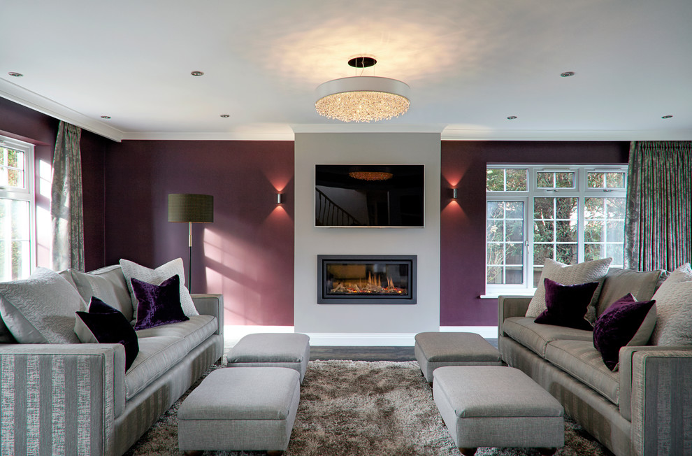 Inspiration for a large contemporary formal enclosed living room in Surrey with purple walls, dark hardwood flooring, a ribbon fireplace, a metal fireplace surround and a wall mounted tv.