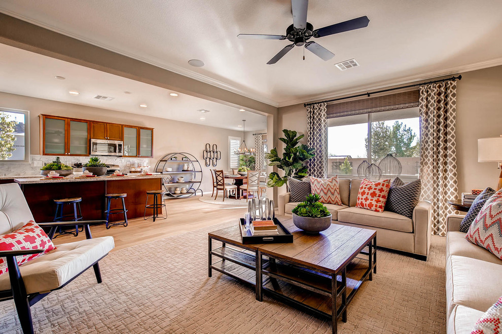Example of a transitional formal and open concept light wood floor living room design in Las Vegas with beige walls