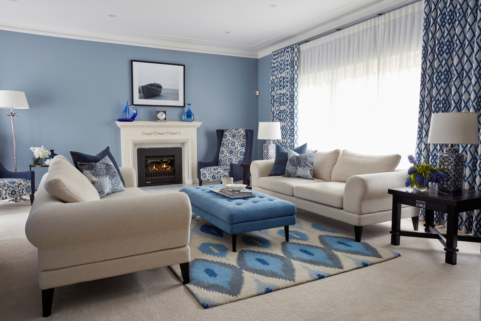 Inspiration for a medium sized contemporary formal living room in Sydney with blue walls, carpet and a standard fireplace.