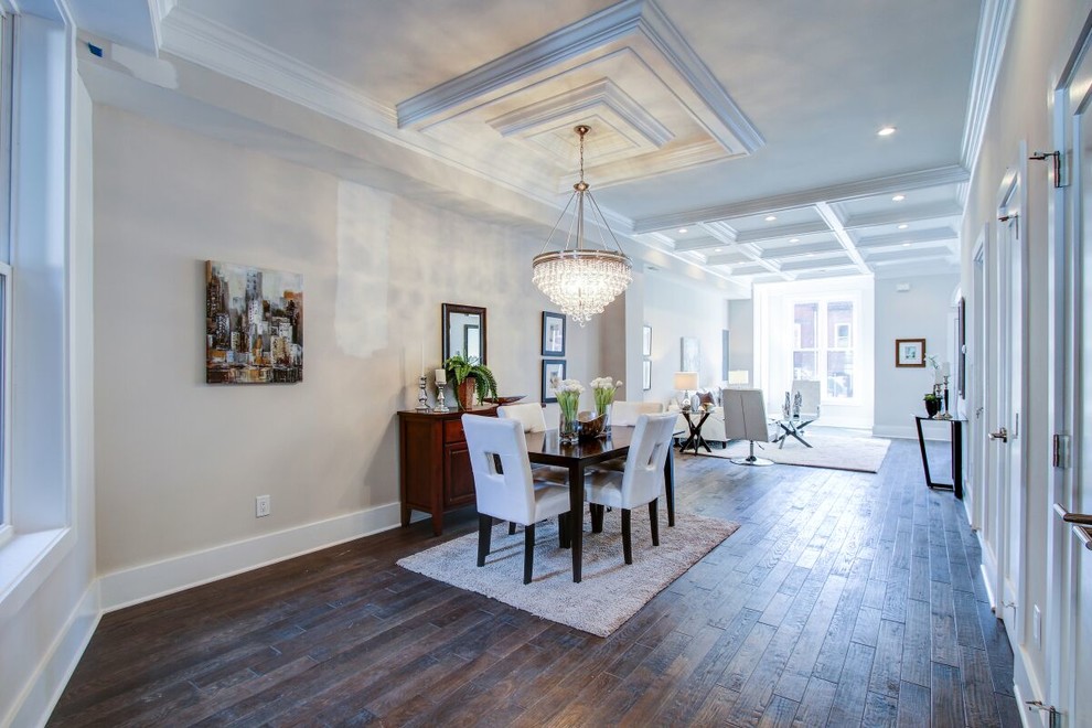 Example of a mid-sized trendy formal and loft-style dark wood floor and brown floor living room design in DC Metro with beige walls, a standard fireplace and no tv