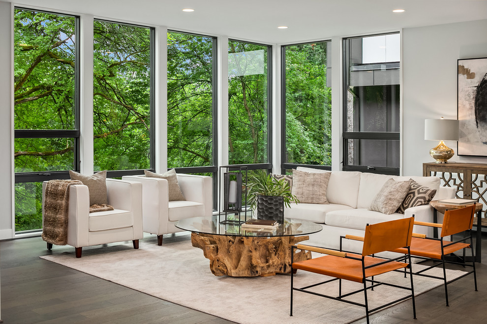 Example of a trendy open concept dark wood floor and brown floor living room design in Seattle with gray walls