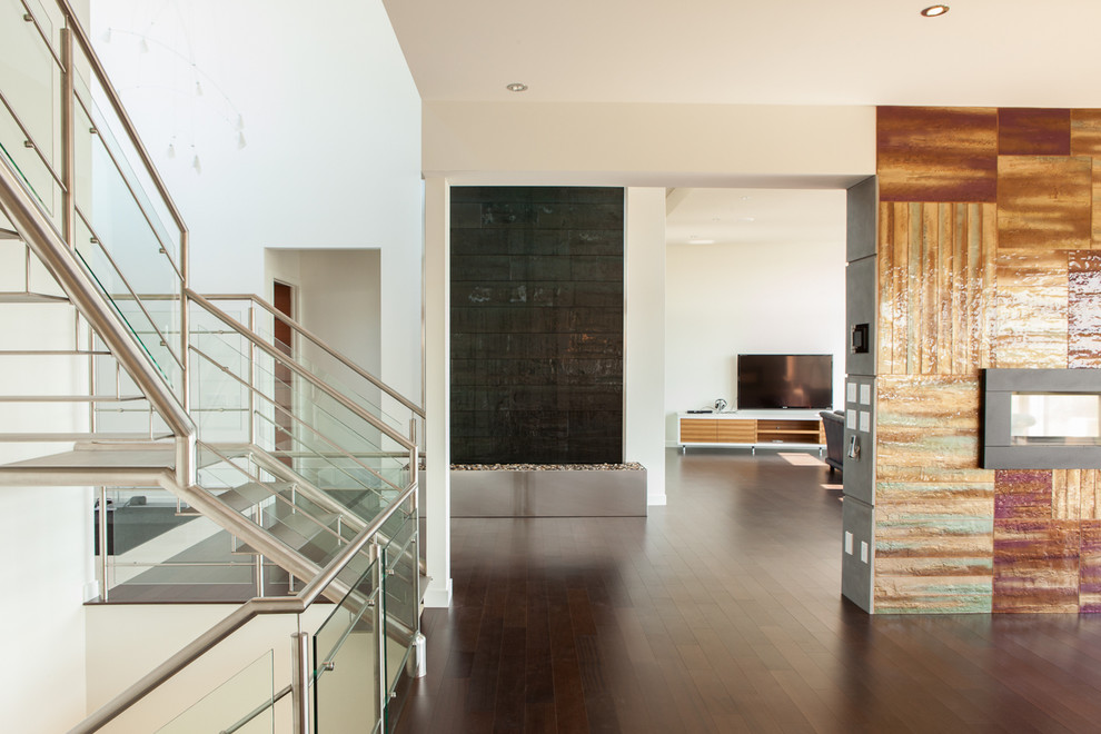 Living room - modern living room idea in Edmonton with white walls and a wall-mounted tv