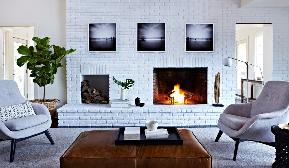 Living room - mid-sized modern open concept dark wood floor living room idea in New York with a corner fireplace, white walls and a brick fireplace