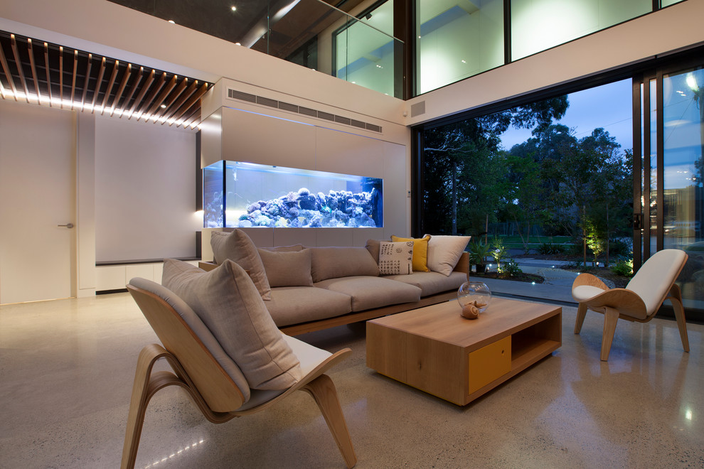 Inspiration for a contemporary concrete floor living room remodel in Melbourne with a wall-mounted tv