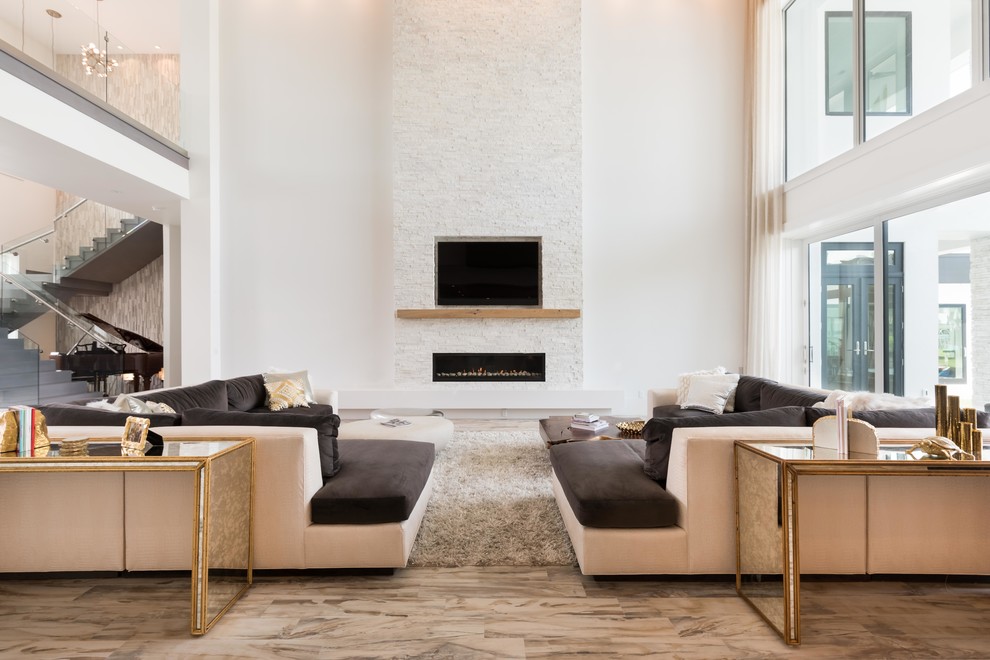 Example of a huge trendy formal and open concept living room design in Orlando with a ribbon fireplace, a stone fireplace and a media wall