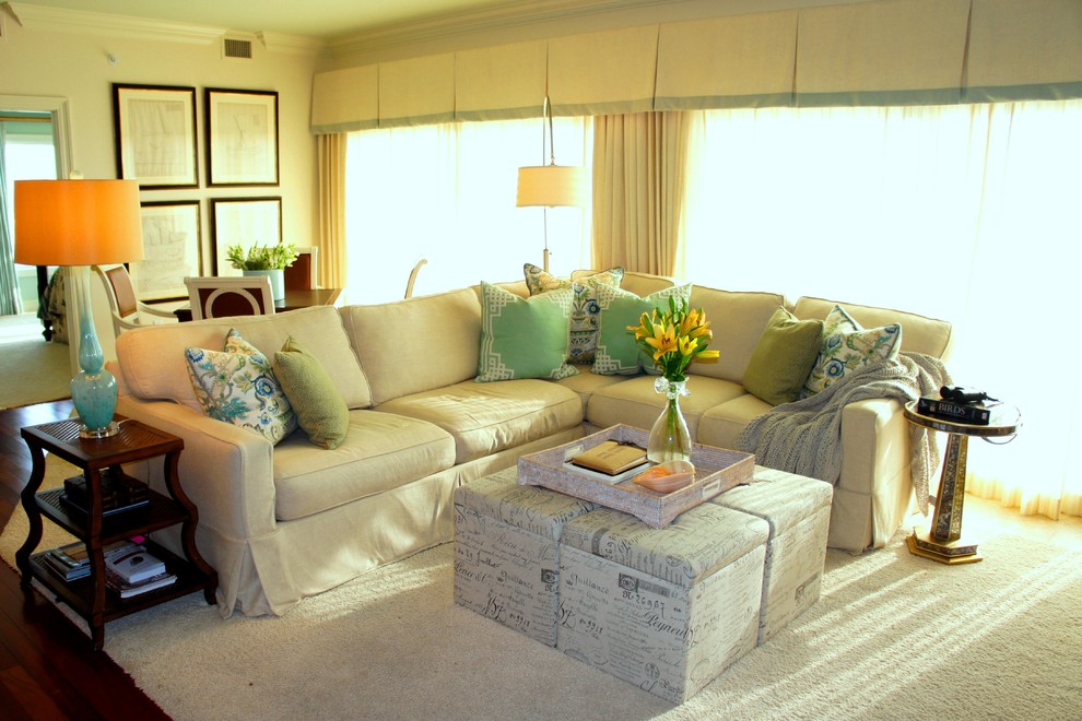 Large beach style open plan living room in Miami with white walls, carpet and a wall mounted tv.