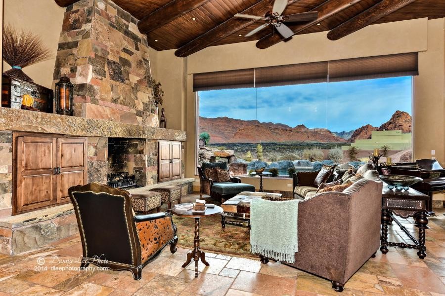 Mid-sized southwest open concept dark wood floor living room photo in Salt Lake City with beige walls, a standard fireplace and a stone fireplace