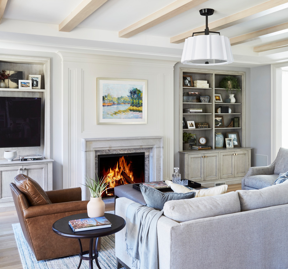 Inspiration for a transitional light wood floor, beige floor and exposed beam living room remodel in Other with white walls, a standard fireplace and a wall-mounted tv