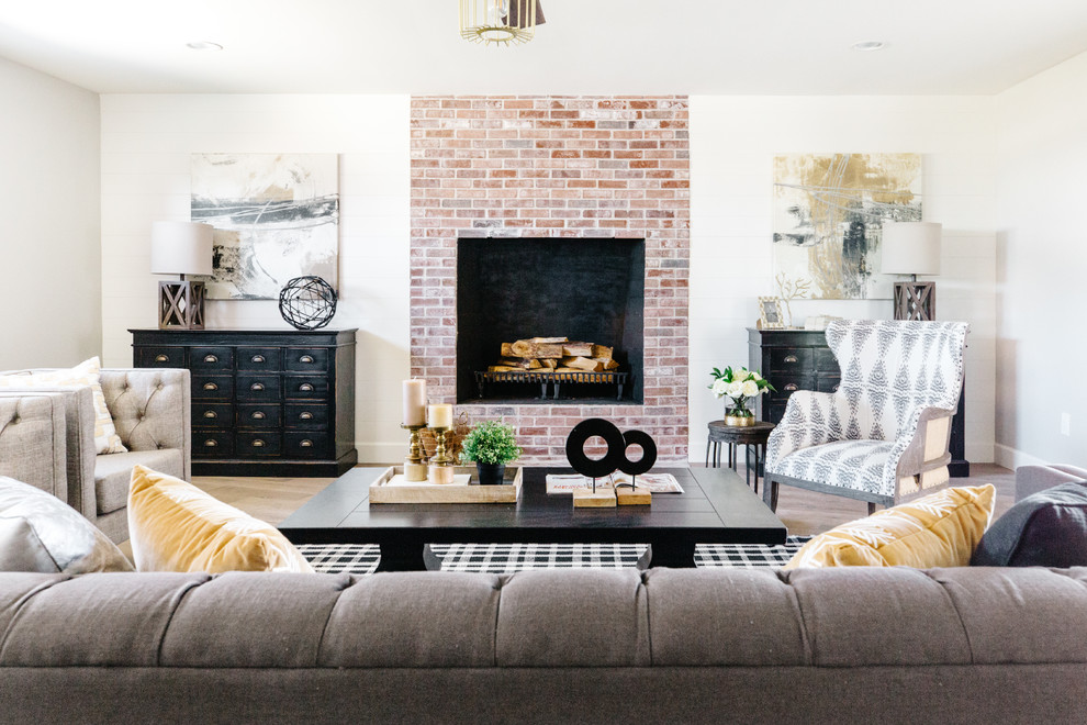 Inspiration for a medium sized farmhouse open plan living room in Phoenix with a standard fireplace, a brick fireplace surround, grey walls, medium hardwood flooring and brown floors.