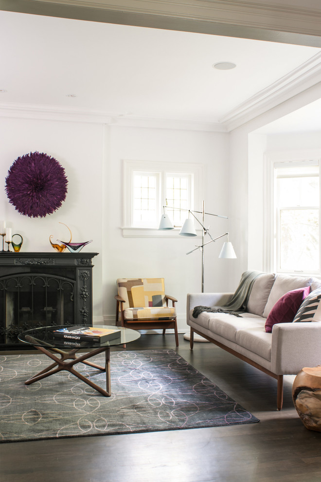 Contemporary living room in Toronto with white walls and a standard fireplace.